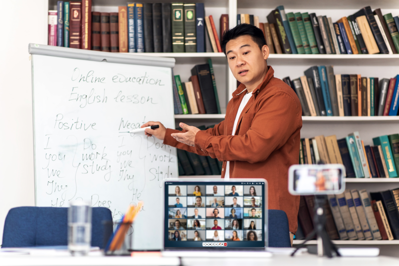 korean-teacher-teaching-group-students-via-video-call-indoor.png