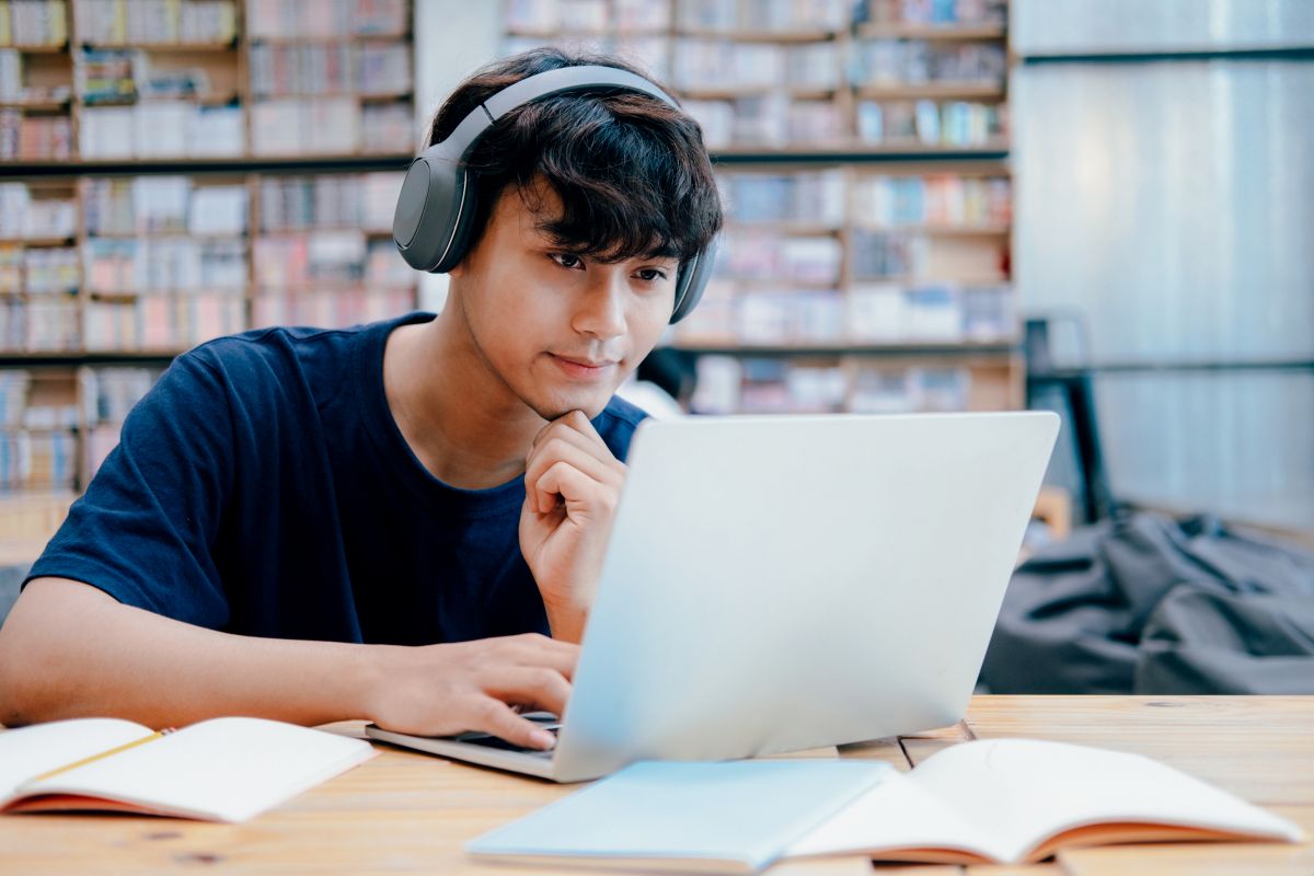 young-collage-student-using-computer-mobile-device-studying-online-education-online-learning